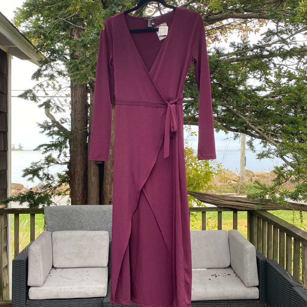 Festive party dress in a  Plum color. Super flattering cut in a rich jewel tone